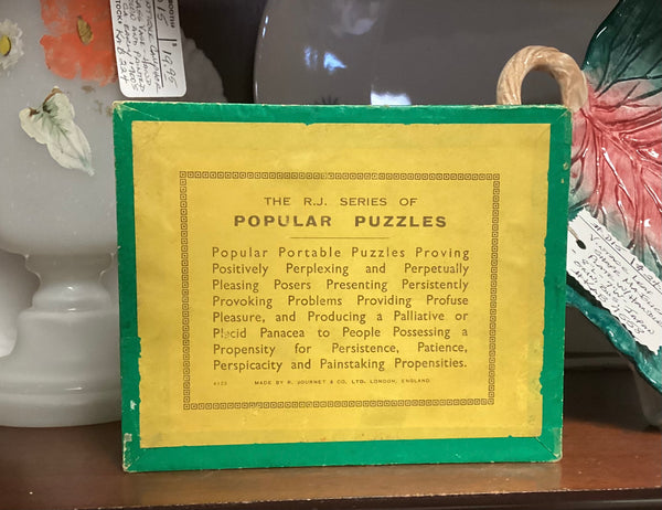 The Turnstile Puzzle Game by R. Journet & Co.