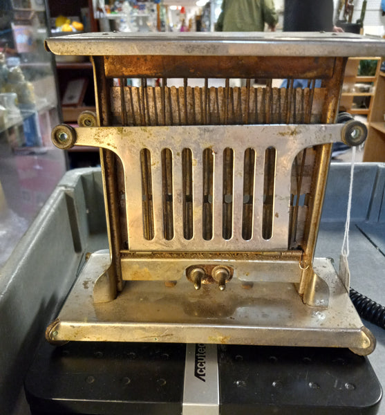 Antique "Universal" Toaster with cord made by Landers, Frary, & Clark